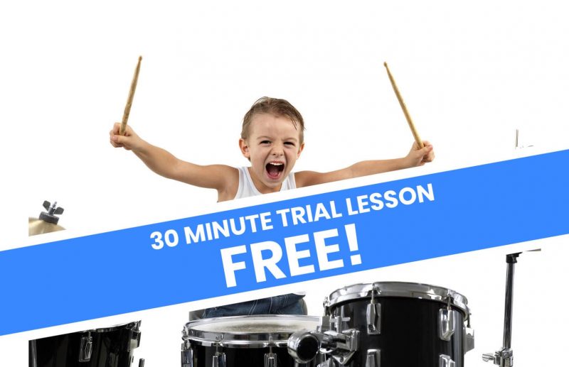 young child playing drums